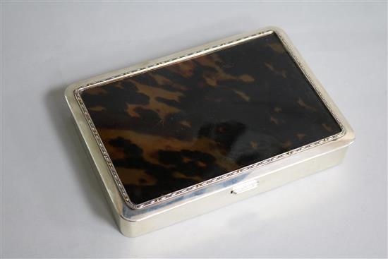 A George V silver and tortoiseshell mounted cigarette box by J. Batson & Son, London, 1917, retailed by Asprey & Co, 15.7cm.